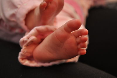 Close-up of baby holding hands