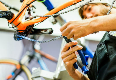 Man repairing bicycle at workshop