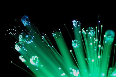 Close-up of fiber optic against black background