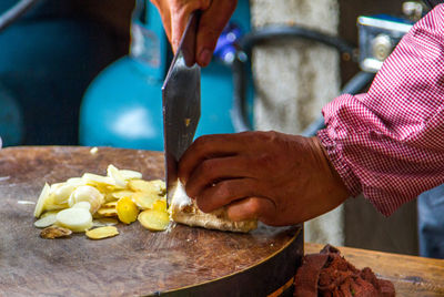 Close-up of man preparing food