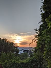 Arch bridge against sky during sunset