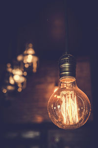 Low angle view of illuminated light bulb