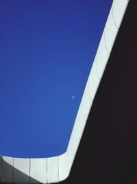 Low angle view of building against clear blue sky