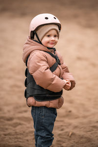 Portrait of boy standing at beach