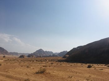 Scenic view of arid landscape against sky