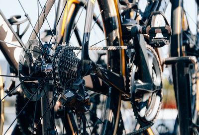 Close-up photo of rear wheel and cassette with chain on professional racing bicycle