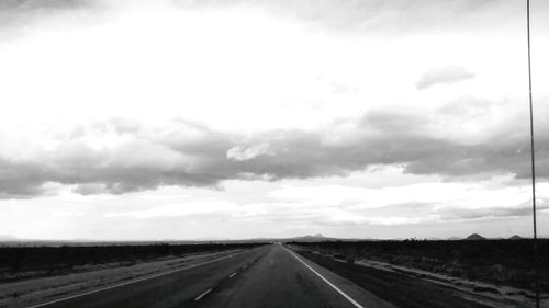 View of road against cloudy sky