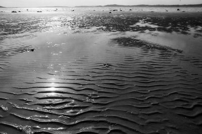 High angle view of raindrops on sandy beach