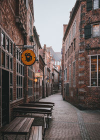 Road amidst buildings against sky in city