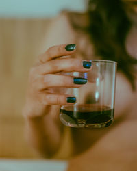 Close-up of woman hand holding drink