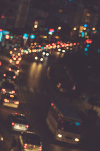 Illuminated traffic on road at night
