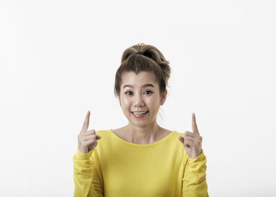 Portrait of mid adult woman against white background