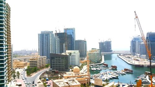 High angle view of buildings against clear sky