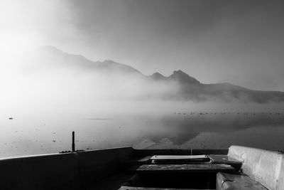 Scenic view of mountains against sky during foggy weather