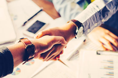 High angle view of business people doing handshake