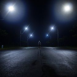 Illuminated street lights at night