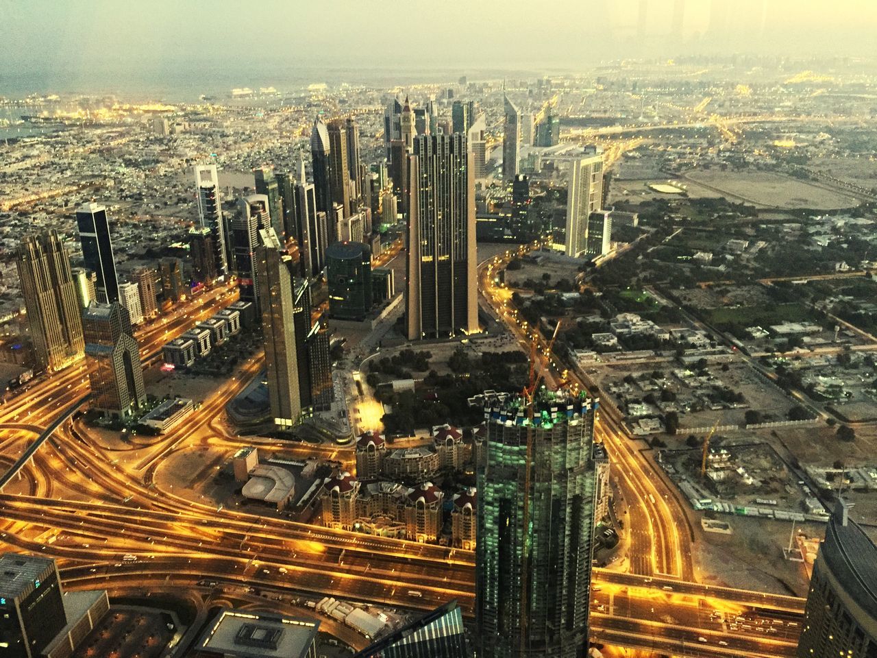 city, architecture, cityscape, building exterior, built structure, skyscraper, aerial view, high angle view, tall - high, crowded, tower, illuminated, modern, capital cities, office building, financial district, city life, travel destinations, night, famous place