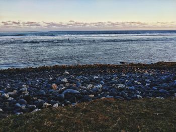 Scenic view of sea against sky during sunset