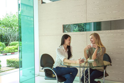 Young women having coffee, bangkok, thailand