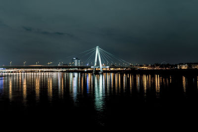 Low angle view of suspension bridge at night