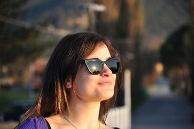 Portrait of young woman wearing sunglasses