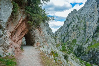 Rock tunnel in cares trekking route, asturias