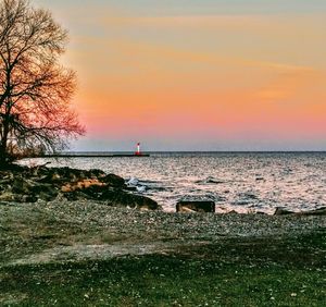 Scenic view of sea against sky at sunset