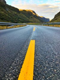 Surface level view of empty road in mountains, norway