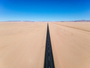 Drone - straight b4 desert road and train line between lüderitz and keetmanshoop in namibia, africa.