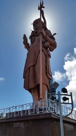 Low angle view of statue against sky