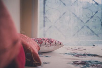 Cropped pillows on bed in bedroom