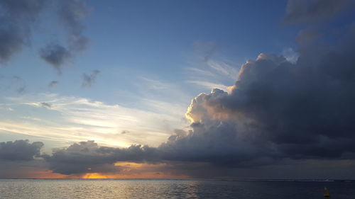 Sunset at sea with thunderstorm looming