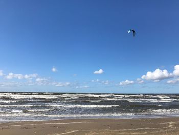 Scenic view of sea against blue sky