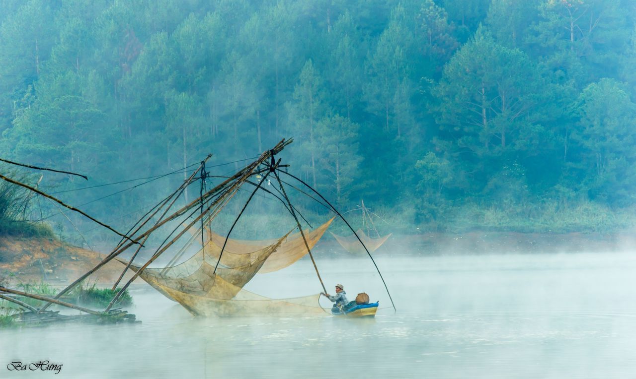 MAN SAILING ON SEA