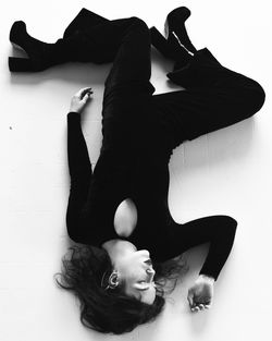 High angle view of woman lying on floor
