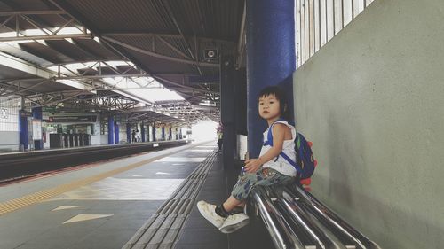 Portrait of woman on railroad station platform