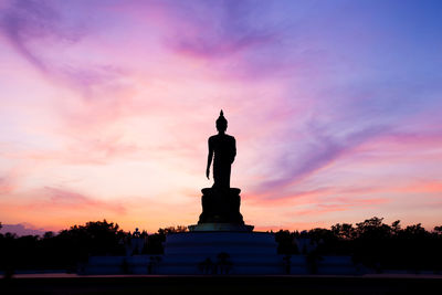 Low angle view of statue at sunset