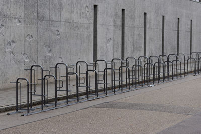 Shadow of railing on footpath