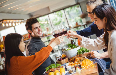 Friends toasting wineglasses at restaurant