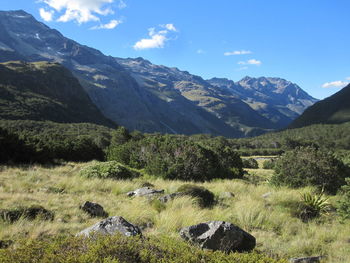 Scenic view of landscape and mountains against sky