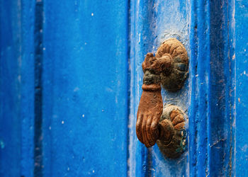 Rusty handle on metal door