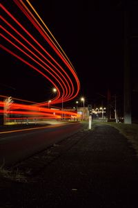 High angle view of light trails on road at night