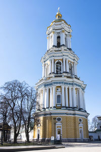 Low angle view of building against clear blue sky