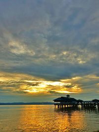 Scenic view of sea against sky at sunset