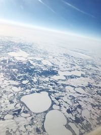 Scenic view of snow covered landscape against sky