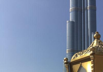 Low angle view of built structure against clear blue sky