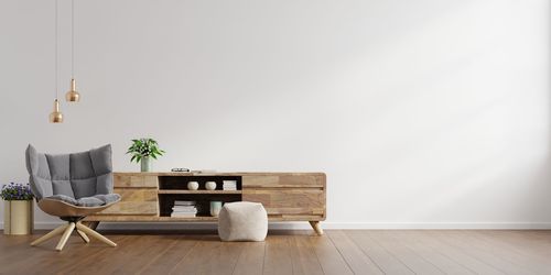 Empty chairs and table against wall at home