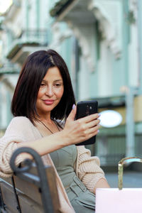 Young woman using mobile phone