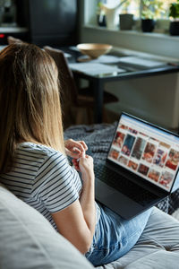 Woman at home using laptop. remote work at home office