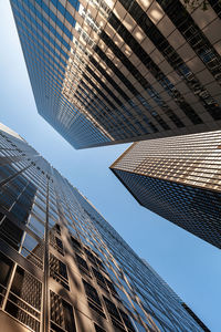 Low angle view of modern buildings against sky